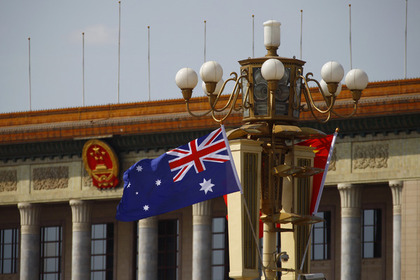 Австралийский флаг на площади Тяньаньмэнь в Пекине